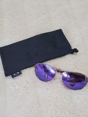Oakley Women’s Gold Frame Sunglasses with Purple Mirrored Lenses